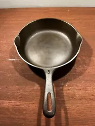 Unmarked wagner no 5 skillet with the factory grind marks still visible. Very clean skillet, no spin, tiniest rock from...