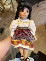 Antique Porcelain doll which has been on a shelf for years 