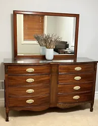 Beautiful vintage Dixie Dresser with Mirror.  Solid wood.  The back leg broke soIt has been replaced. See pictures.I...