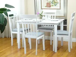 This kitchen furniture includes a table and four side chairs. The table and chairs are made of wood, and the chair...