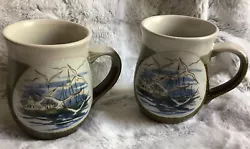 No chips or cracks...4 1/4 “ high ...Vintage Pottery 2 Mugs Seaside Nautical Boat Seagull Harbor Blue Tan. Condition...