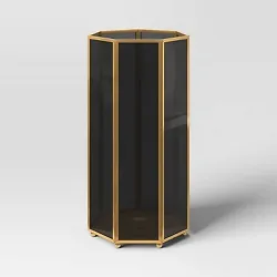 •Outdoor lantern candleholder •Heptagonal silhouette with open top •Gold-finish metal frame with black glass...
