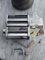 This vintage manual pasta maker, made in Italy, comes complete in its original box. The box shows moderate ware and has...