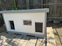 Hand made by my Dad for my two large dogs. I now have small, inside dogs and no longer need this dog house. It is high...