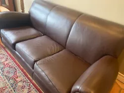 Excellent used condition. Indulge in the luxurious comfort of this full hide leather sofa, perfect for any home decor....