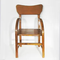 Blonde brown finished wood, appears to have a shellac type of coating. Overall this chair is. Stylish curve to the...
