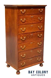 The chest has 7 drawers all retaining their original brass pulls, locks, and escutcheons. The chest has bun feet and is...
