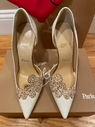Add a glamorous touch to your wedding ensemble with these Christian Louboutin Lady Cloud 100 pumps. These pre-owned...