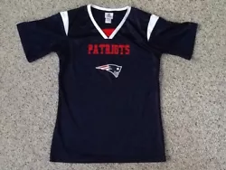 New England Patriots football jersey in very good condition size is marked as girls large 14-16