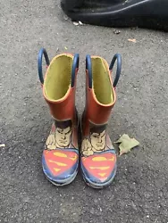 western chief superman rain boots size 10. Used. but still have a few seasons left in them.