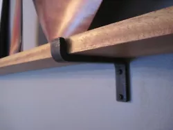 Each bracket has a natural fire blacken finish with a protective wax coating that we add by hand. Black Iron Shelf...