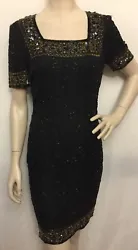 Glamorous cocktail or mother of the bride black and gold sequin dress. Size 4 short sleeves.New with tag. No...
