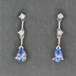 0.12 ctw diamonds. 21 mm long. 6x4 mm tanzanites (0.90 CTW).