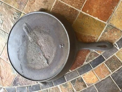 cast iron gatemarked fancy handle 10 3/4” skillet. Looks like a no. 8 on top of handle and a Z or underLined 7 on...