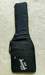 Gibson USA Padded Guitar Gig Bag. One zippered pouch and one loop/latch pouch on front for accessories. Padded handle...