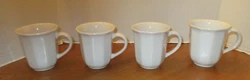 They have a handle. Two mugs are marked Condition: In great used condition. These four mugs would make a great addition...
