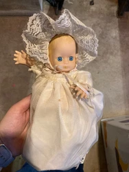 Antique Porcelain doll which has been on a shelf for years 