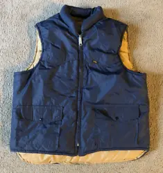A vintage Lee Storm Rider mens zip front puffer vest in nice pre-owned condition - a small wear spot on the collar (see...