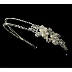 This enchanting floral headband features two side-set freshwater pearl and swarovski crystal flowers. Rhinestones sit...