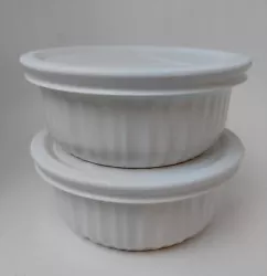 2 small French White Corningware dishes with lids.