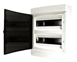 1 Porte translucide teinté réversible. Nombre de modules 24 modules. - 1/2 Bande dobturateur ( soit Obturateur...