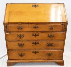 This Chippendale style Slant Front Desk is made of Tiger and birdseye maple wood and probably dates to around 1860. The...