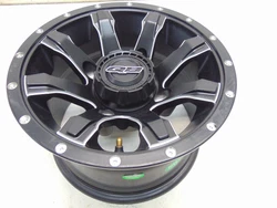 QuadBoss Grinder Wheel 12x7 5+2 Offset 4/137 Matte Black with Machined Edge.