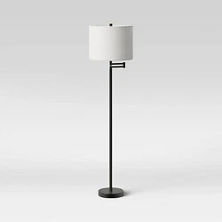 •Metal column floor lamp with drum shade •Features an adjustable swing arm •3-way touch-activated sensor switch...