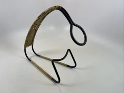 This wine bottle holder is around 9” long, and 8” tall. Overall condition is good. Some discoloration to rayan as...