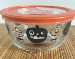 This is a Pyrex 4cup Halloween bowl. It is #7201 and has black pumpkins and orange plastic lid. Has label on lid and...