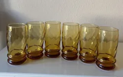Glasses have beautiful swirled pattern, deep amber coloring, and have the Libbey cursive L on bottom of glasses....