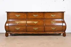 A gorgeous French Provincial Louis XV style bombay form triple dresser or credenza. Carved solid oak, with burl wood...