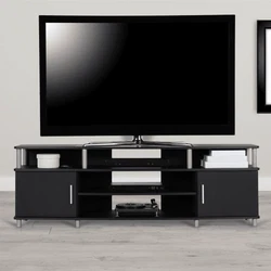 TV Stand accommodates up to a 70” flat paneled TV with a maximum weight of 120 lbs. The top shelf holds up to 120...