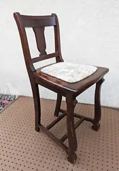 Elegant, antique, sewing chair salvaged from Northeastern Pennsylvania. Its made of solid wood (most likely walnut) and...