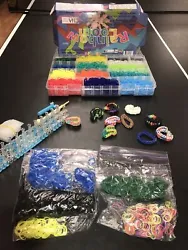 Rainbow Loom Kit and Huge lot of Rubber Bands 12 colors. Additionally there are Bonus Bracelets. It is in Great...