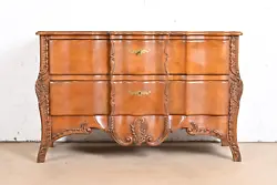 By John Widdicomb. A gorgeous French Provincial Louis XV style commode or dresser chest. Carved solid cherry wood, with...