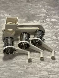 This is aPlastic Grinder Grater With 3 Stainless Steel Drums VTG. The item pictured is the one that you will receive.