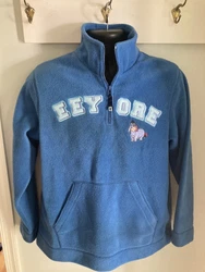 Stay cozy and stylish with this womens 1/4 Zip Fleece from the Disney Eeyore collection. The blue pullover features an...