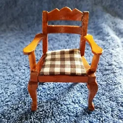 Item: Wood chair with buffalo plaid seat cushion. I saw no markings. The seat cushion is glued to the chair and one...