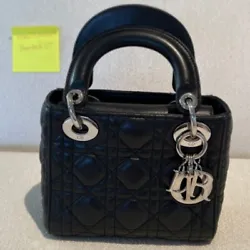 Mini lady Dior black cannage lamb skin bag in very good condition with original black leather strap silver hardware.