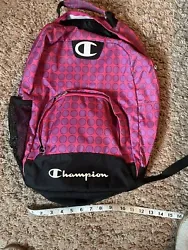 This backpack by Champion is perfect for girls who need to carry their belongings in style. The bag has a pink canvas...