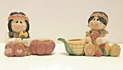 These adorable preowned candle holders are just about 3
