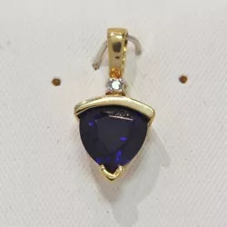 8 MM created sapphire pendant with diamond accent. 19 mm long. 9.4 mm wide.