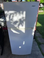 Whirlpool Refrigerator. It is in need of a good cleaning but is in working order. 