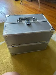 Holds numerous makeup items, jewelry, or anything else. Has lock and key