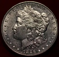 Here we have one 1886 Morgan Dollar. This coin has been polished. The coin is in raw uncertified condition and is a...