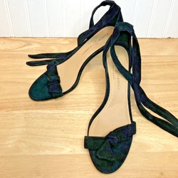Ties at the ankle. Black faux suede.