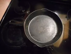 ERIE 8 SKILLET THAT NEEDS CLEANED UP.HAS A DEEP SCRATCH ,ACTUALLY HAS A LOT OF SCRATCHES FROM 100 YEARS OF USE.
