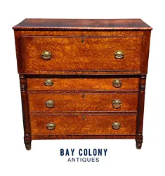 One of the most notable features of this desk is its top drawer, which opens to reveal seven interior drawers. The...