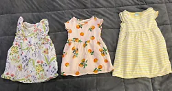 Baby girl size 6-12 months. Two are brand Old Navy, one yellow stripes other is pink with oranges. Floral dress is...